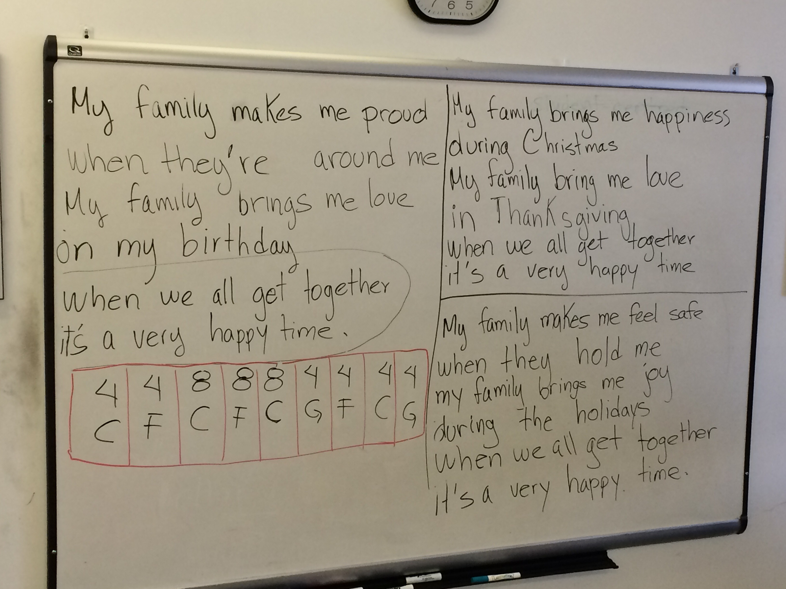 photo of the whiteboard showing revised version of kids' first song.